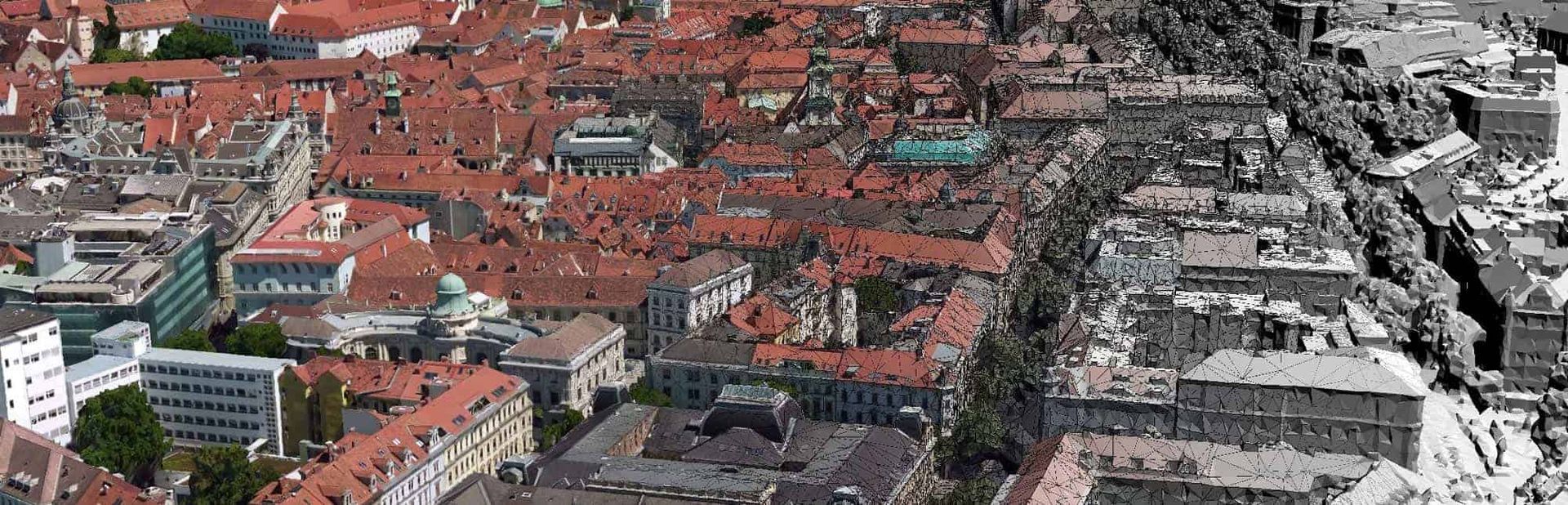 Toàn cảnh thành phố từ trên cao với dãy nhà nhiều màu sắc bên trái đối lập với các tòa nhà xám bên phải.