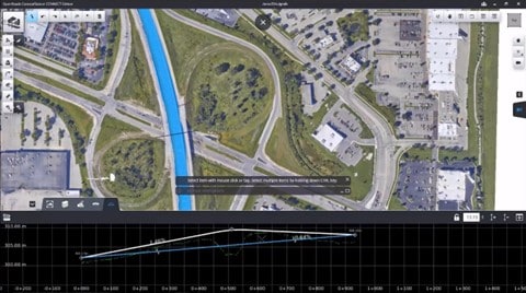 Màn hình hiển thị bản đồ vệ tinh với nút giao thông và sông chảy qua, tạo bởi OpenRoads ConceptStation. Bên dưới là biểu đồ với các điểm dữ liệu minh họa tác động tiềm năng của dự án.
