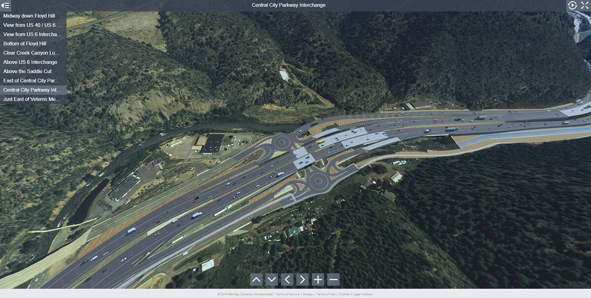 Hình chụp trên không của nút giao thông lớn với nhiều làn, cầu vượt, vòng xoay bao quanh bởi cây cối, đồi núi—thể hiện diện mạo của những con đường tương lai được tạo nên nhờ công nghệ tiên tiến.