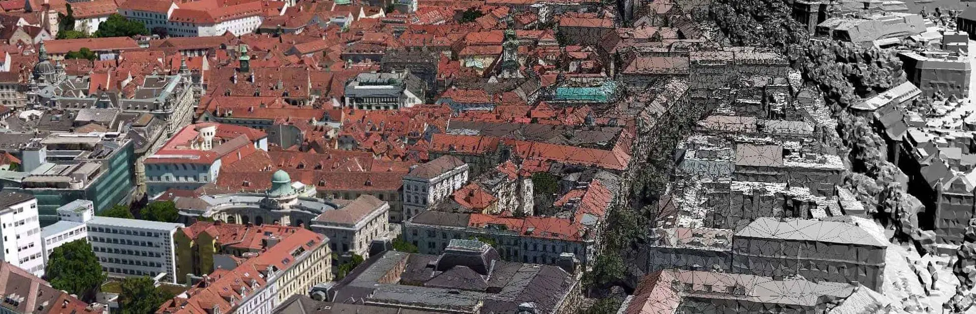 Toàn cảnh thành phố từ trên cao với dãy nhà nhiều màu sắc bên trái đối lập với các tòa nhà xám bên phải.